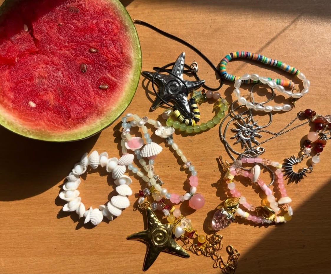 Handcrafted Fringe accessories laid out on a wooden table